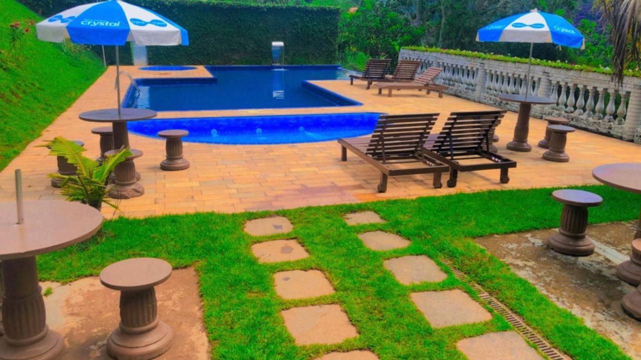 Pousada Nossa Senhora Penedo  Bagian luar foto The pool at the hotel